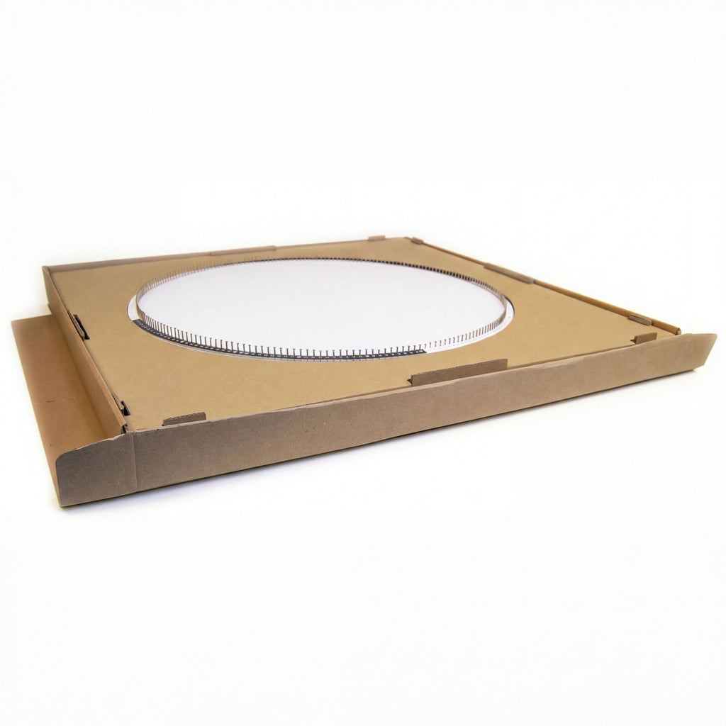Pre-drilled circular wooden base for a string art DIY kit, shown lying flat in the packaging