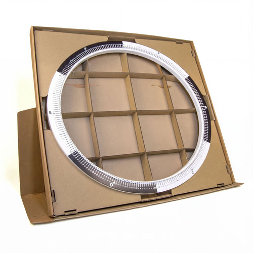 Open String Art DIY kit box showing the inner cardboard structure and circular frame area